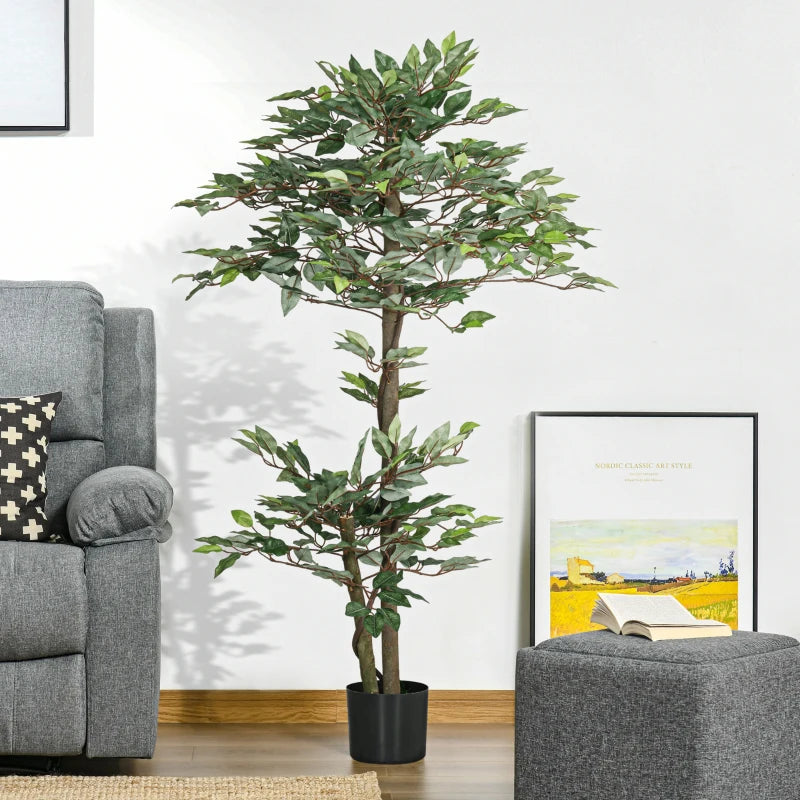 Ficus artificial Kyoto colocado junto a un sofá en un salón