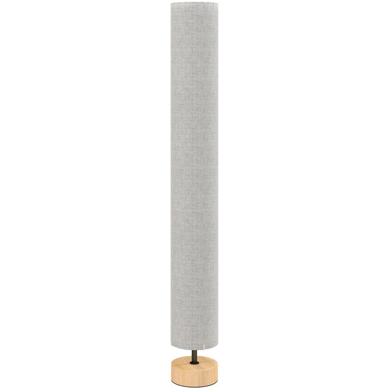 Lámpara de pie Belisaria con pantalla de lino gris y base de madera en un salón moderno