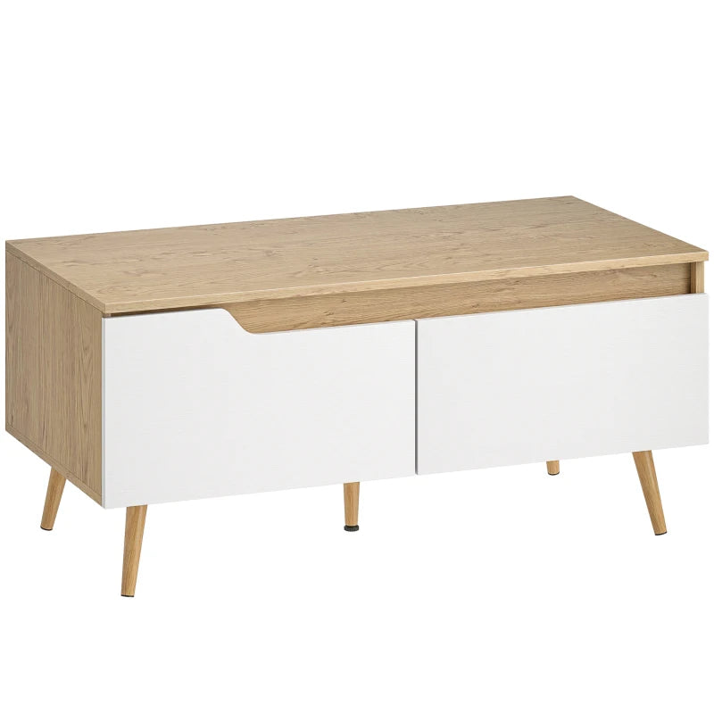 Mesa de centro Ardil con tapa de roble y cuerpo blanco sobre patas de pino en un salón nórdico