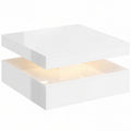 Mesa de centro Blitzón blanca con iluminación LED RGB encendida en un salón moderno