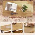 Mesa Auralite con el tablero subido a 50 cm mostrando la superficie de trabajo sobre el sofá