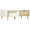 Mesa de centro Ordnungo en blanco con patas de madera de haya en un salón nórdico