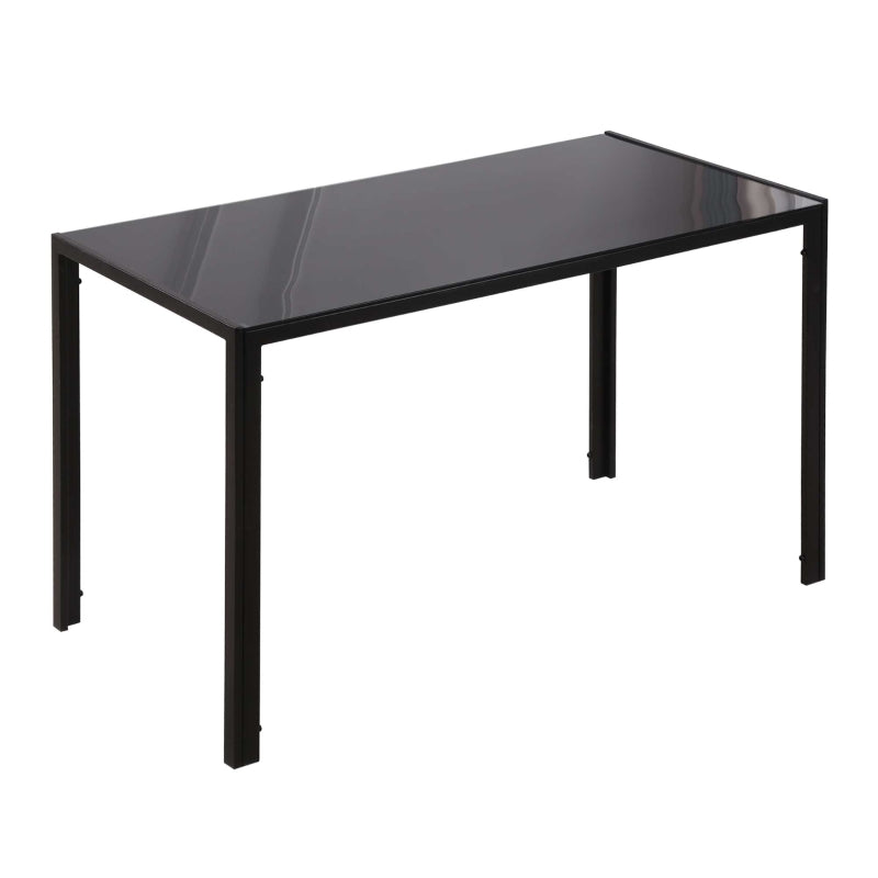 Mesa de comedor Shadó de cristal templado negro con patas de metal en un comedor moderno
