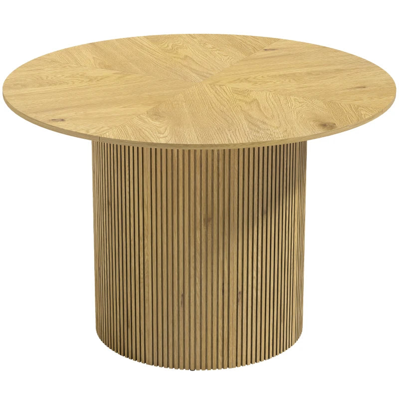 Mesa de comedor redonda Tondó en acabado roble con pedestal acanalado en un comedor moderno