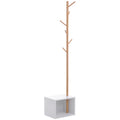Perchero de pie Kodama de bambú con forma de árbol y banco inferior en una entrada moderna