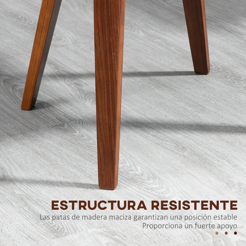 Detalle de las patas cónicas de madera en tono nogal oscuro de la silla
