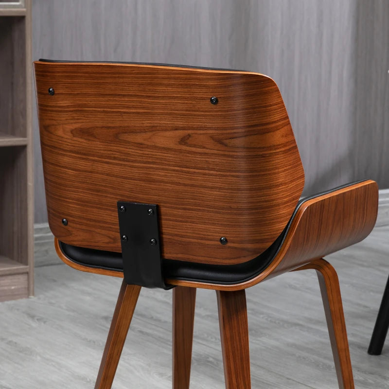Detalle del respaldo curvado envolvente de la silla de comedor