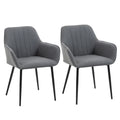 Set de dos sillas de comedor Ashford tapizadas en lino gris con reposabrazos y patas de metal en un comedor moderno