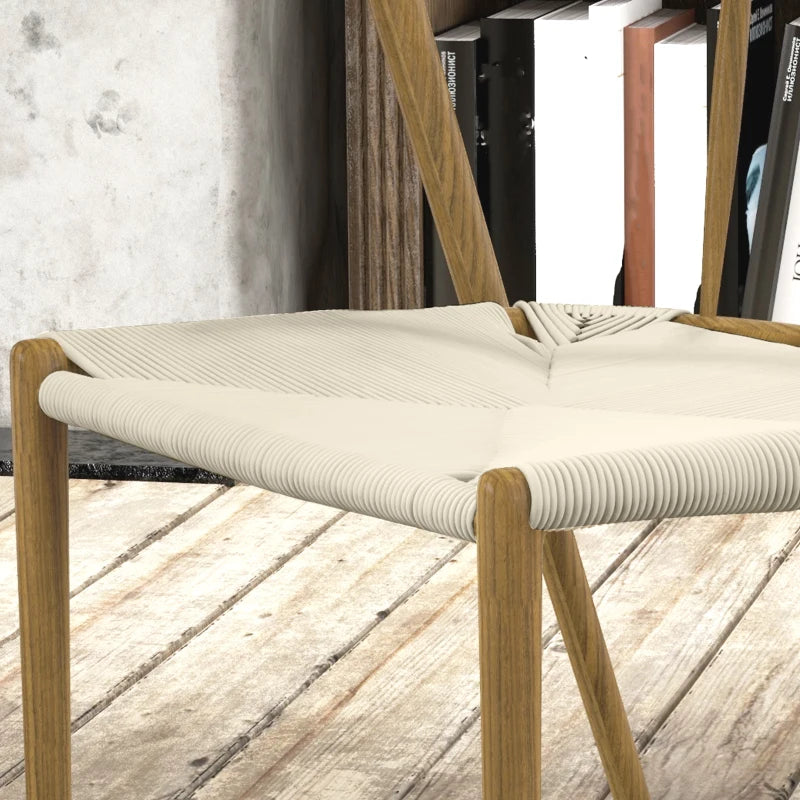 Detalle del asiento tejido a mano en cuerda de papel color crema de la silla Halden