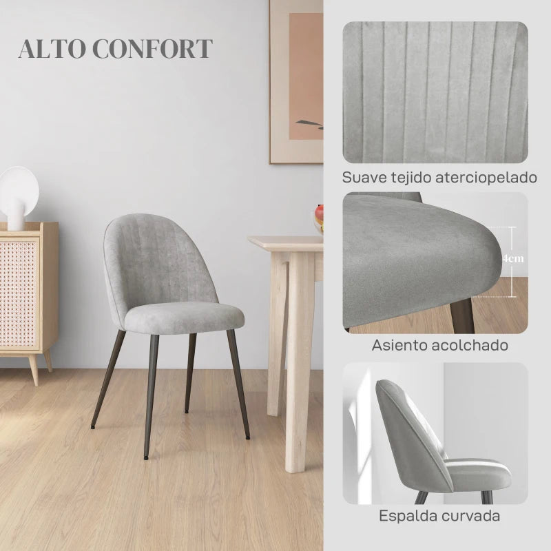 Detalle del respaldo alto curvo tapizado en terciopelo de la silla
