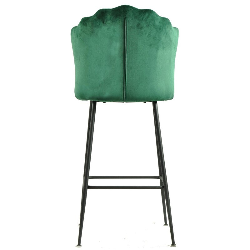 Detalle del respaldo tapizado en terciopelo verde oscuro