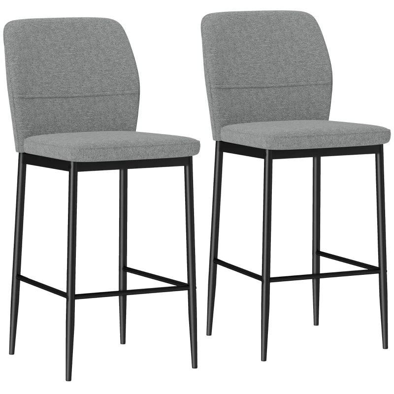 Set de 2 taburetes altos Menton de terciopelo gris con patas de acero negro en una cocina